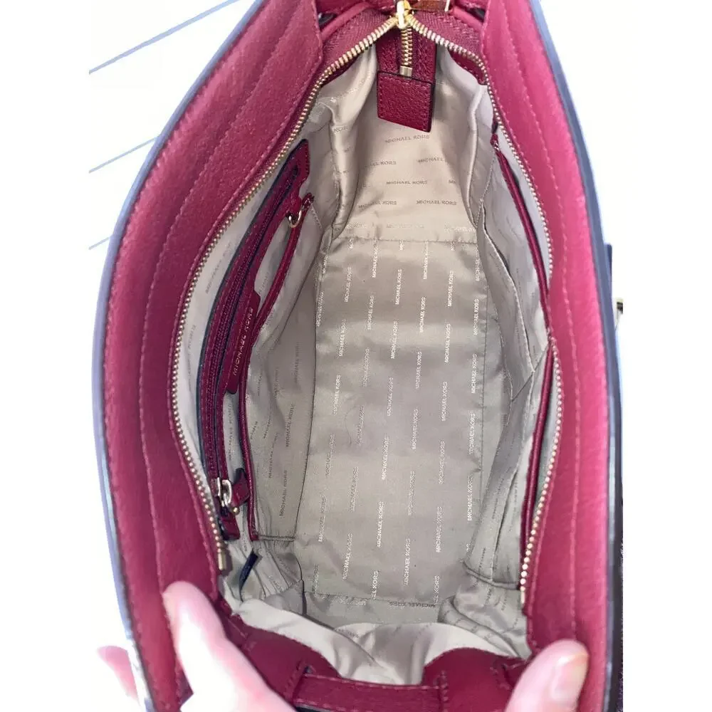 MICHAEL KORS, LARGE WINE LEATHER HANDBAG WITH LOCK CHARM.